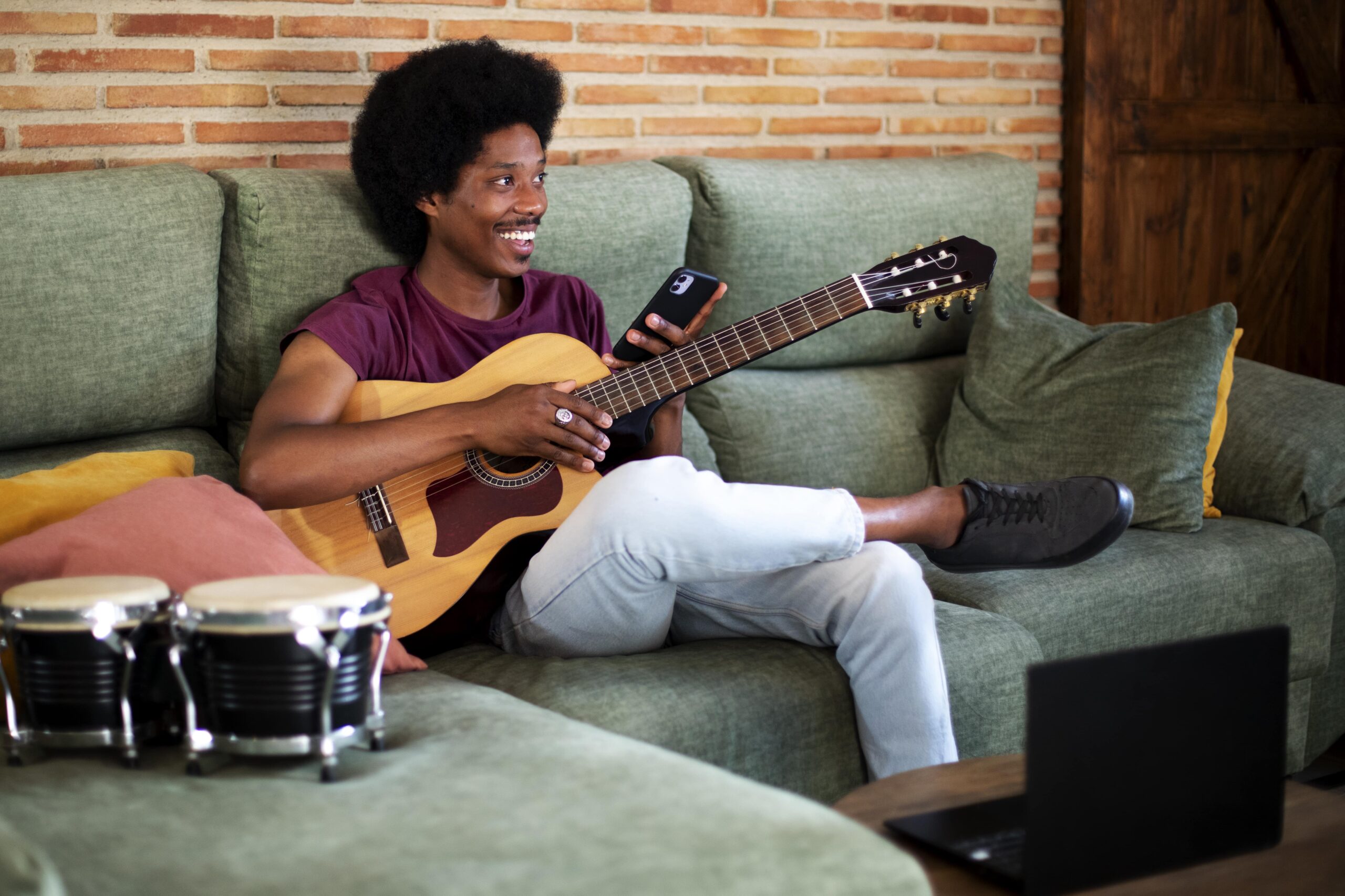 Someone having guitar lessons at home